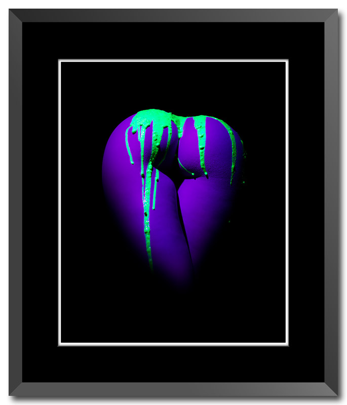 Fine art photograph by Central Illinois photo artist Craig Stocks showing a naked female bottom covered with green slime under a black light