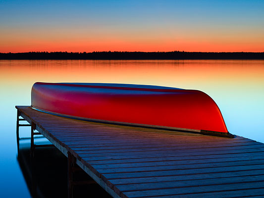 Red canoe at Riding Mountain National Park, Canada